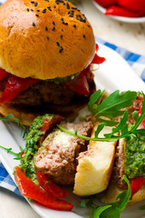 feta stuffed turkey burgers with arugula pesto and roasted red peppers.