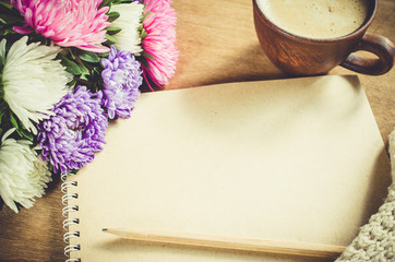 Blank brown notebook with autumn flowers.