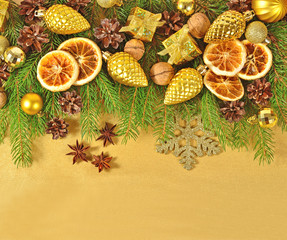 Fototapeta na wymiar Dried oranges and cones, Christmas decorations and spruse branch