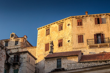 Fototapeta na wymiar Ancient buildings of historic center of the Croatian town of Sibenik at the Mediterranean Sea, Europe.
