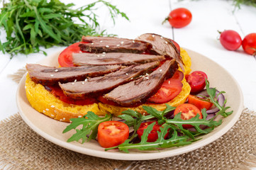 Useful sandwiches: goose breast on pumpkin bread, salad from tomatoes, arugula, red onions.