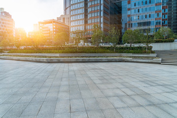 Fototapeta premium empty brick floor with modern office building in shanghai