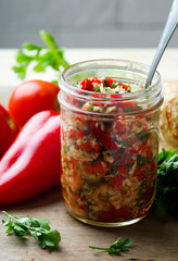 the crushed vegetables and roots in a glass jar