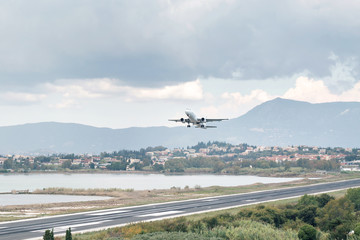 Corfu island, Greece. Modern passenger airplane landing at international airport.