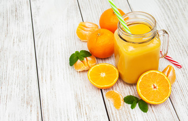 Fototapeta na wymiar Jar with orange juice