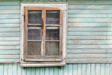 Naklejka na ściany i meble The old window of old wooden house. Background of wooden walls