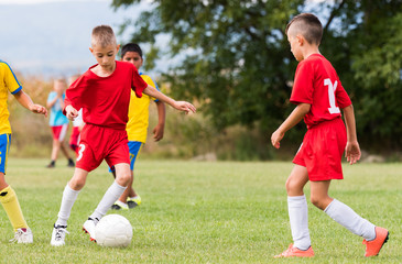 Kids soccer football - children players match on soccer field © Dusan Kostic