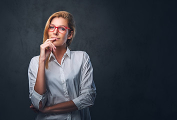 Attractive blond business woman in a white shirt.