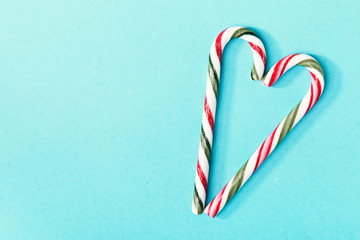 Candy canes composed on blue