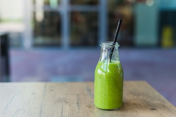 Delicious carrot green spinach, mango and banana cocktail