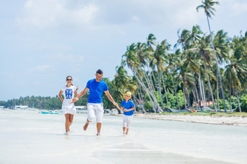 Family of three having fun at the beach