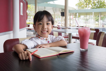 Asian Chinese little girl doing homework