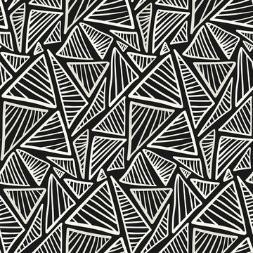 Monochrome pattern with scribble hand drawn triangles. Vector fashion texture in black and white colors for textile, wrapping paper, cover, surface, wallpaper, background