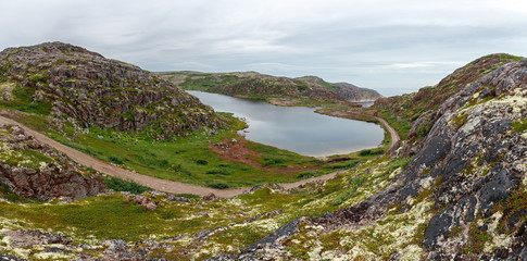 Lake with clean, fresh water on the shore of the Barents sea. Kola Peninsula , Russia.
