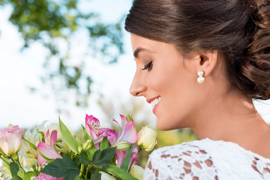 tender woman with bouquet of flowers