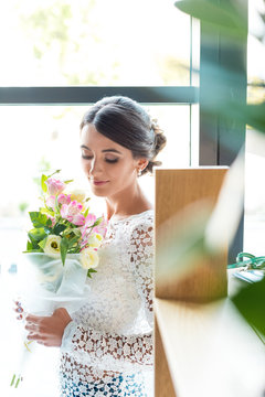 beautiful woman with bouquet of flowers