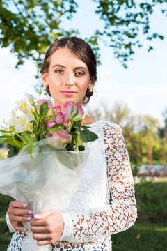 beautiful woman with bouquet of flowers