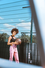 african-american woman holding basketball