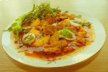 A bowl of delicious beef and tomato, potato