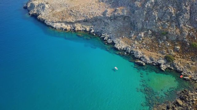 Aerial View: Drone video of iconic beach of Agathi and castle of Feraklos, Rodos island, Aegean, Greece