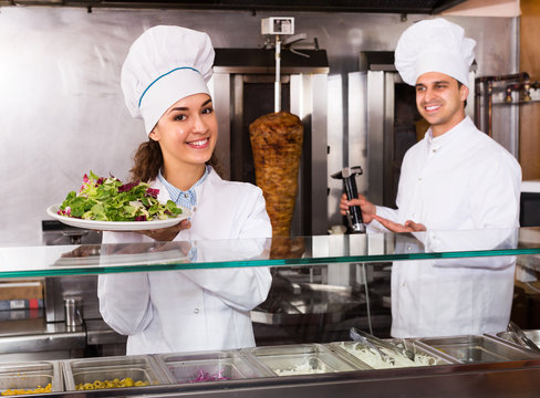 Staff posing at kebab counter