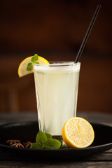 Fresh homemade lemonade with mint leaves on wooden table
