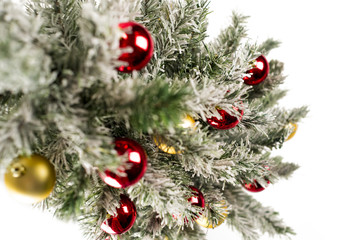 Christmas tree with colorful ornaments, isolated on white