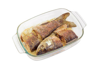 Baked grass carp in the glass pan for baking