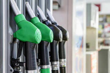 Gasoline and diesel distributor at the gas station. Gas pump nozzles.