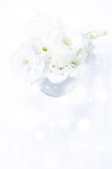 Wedding white roses bouquet background bokeh.