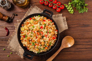 Fried rice with chicken. Prepared and served in a wok.