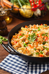 Fried rice with chicken. Prepared and served in a wok.