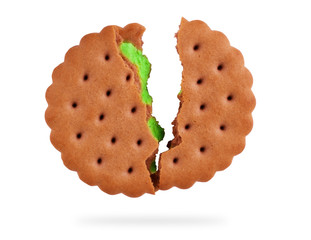 opened mint creme sandwich cookie in front of several cookies isolated on a white background.