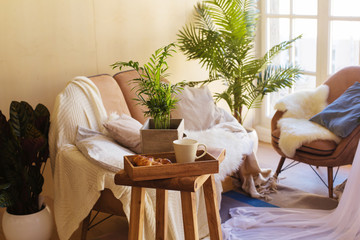 Morning cup coffee or tea with croissant apartment interiour