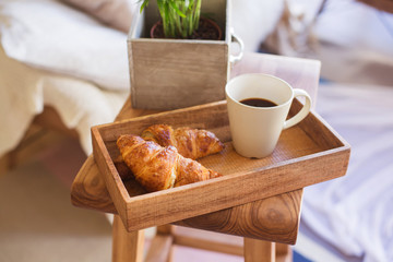 Morning cup coffee or tea with croissant apartment interiour