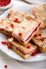 Red currant fruit pie bars with meringue on top.