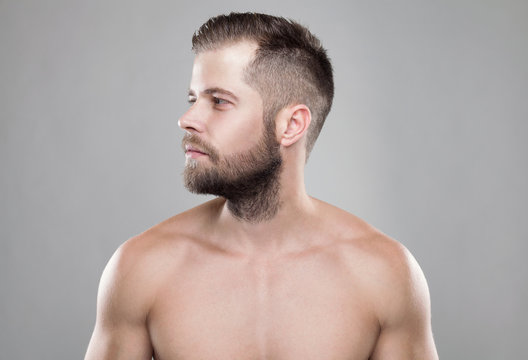 Portrait of young bearded man with a new hair cut