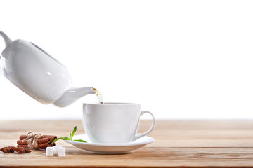 Cup with green tea on wooden background