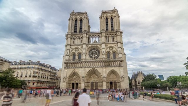 Front view of Notre-Dame de Paris timelapse hyperlapse, a medieval Catholic cathedral on the Cite Island in Paris, France