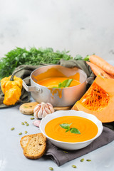 Fall autumn roasted orange pumpkin carrot soup with garlic
