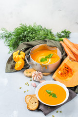 Fall autumn roasted orange pumpkin carrot soup with garlic