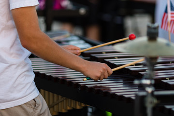 percussionist playing a vibraphone during a rehearsal