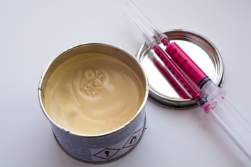 Small jar with car putty.