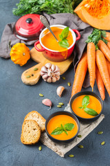 Fall autumn roasted orange pumpkin carrot soup with garlic