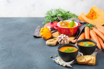 Fall autumn roasted orange pumpkin carrot soup with garlic