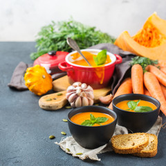 Fall autumn roasted orange pumpkin carrot soup with garlic