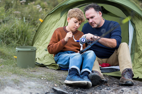 Father teaching Son how to fish