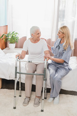 nurse and senior patient with walker