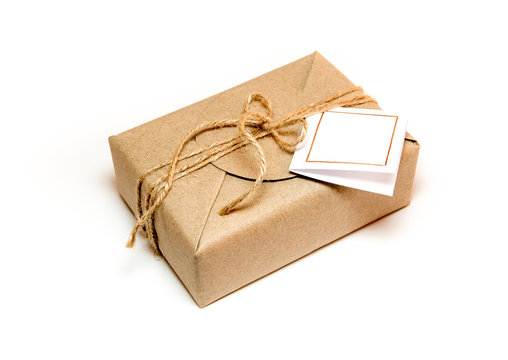 Gift box wrapped in kraft paper and rustic hemp as natural rustic style