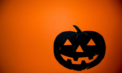 Halloween pumpkin on orange background. Poster or banner for Trick or Treat Halloween party with scary pumpkin.